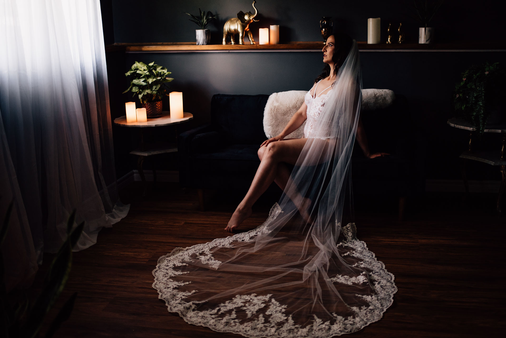 bride in a veil during boudoir session