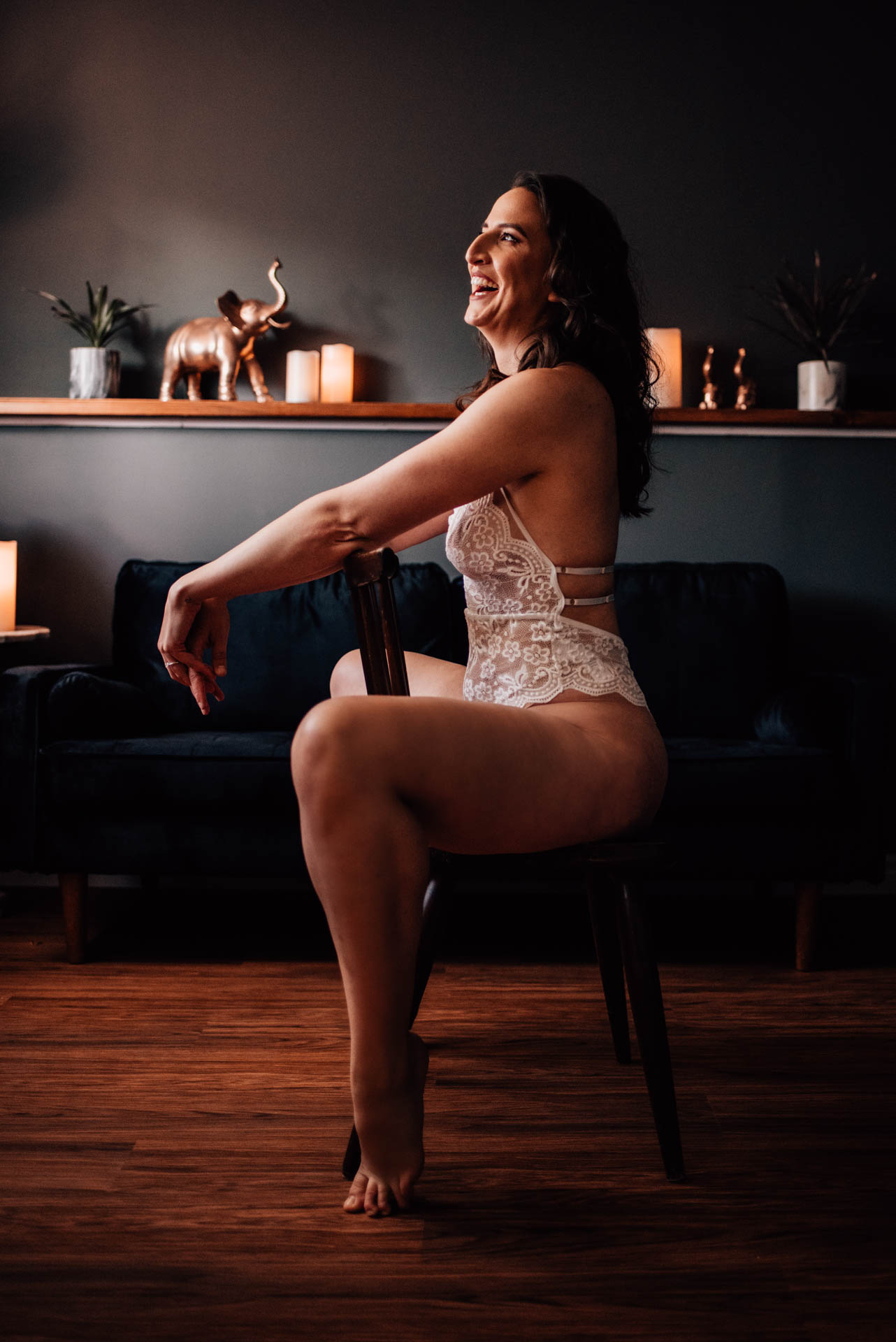 woman laughing during bridal boudoir experience