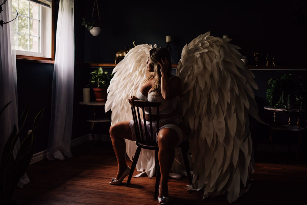 woman wearing ottawa boudoir photographer's angel wings