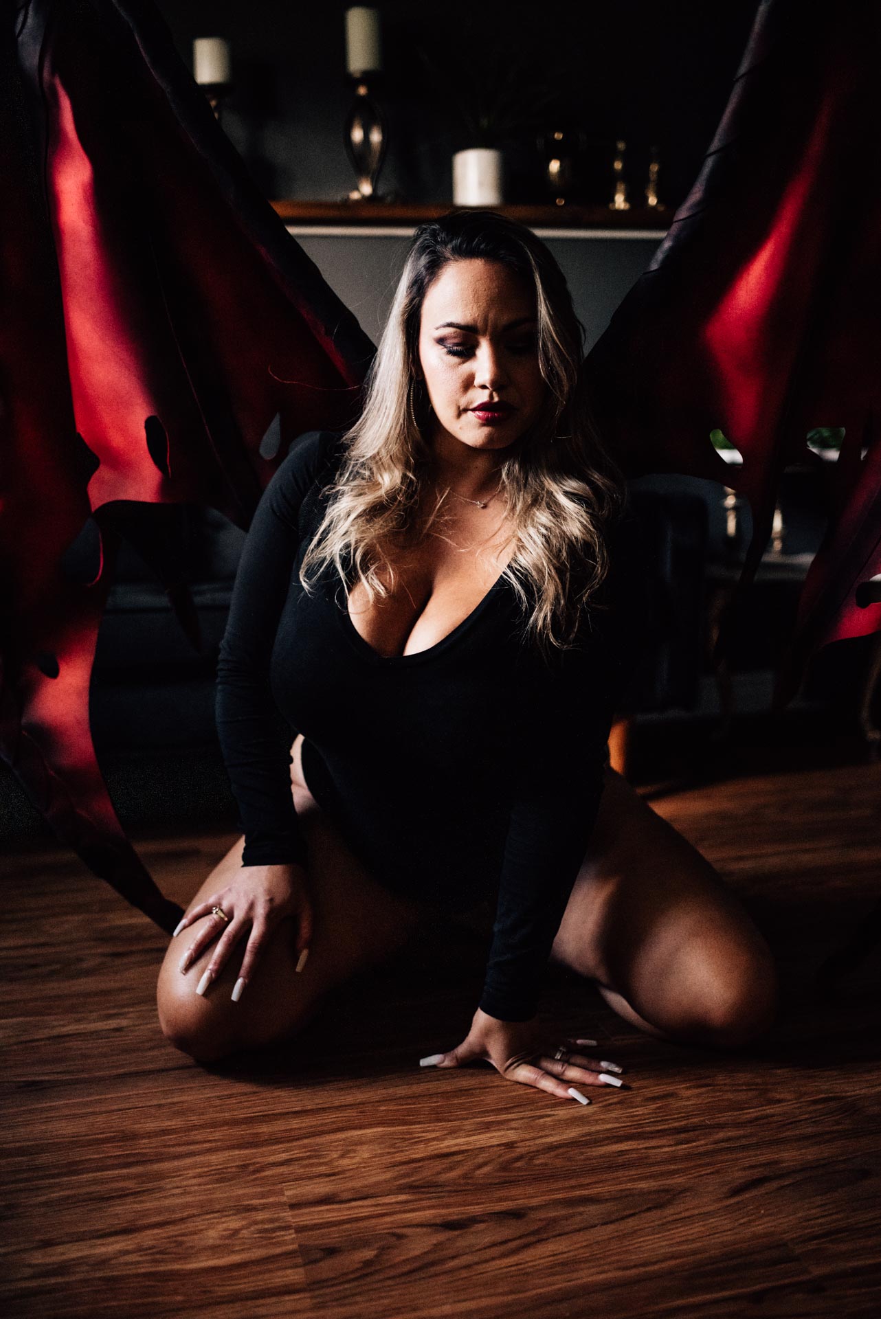 woman modelling devil wings for Ottawa boudoir photographer
