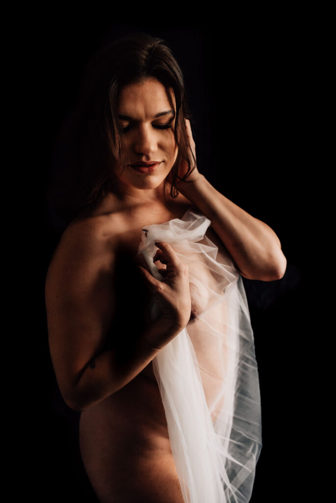 woman posing with veil for intimate portraits Ottawa session